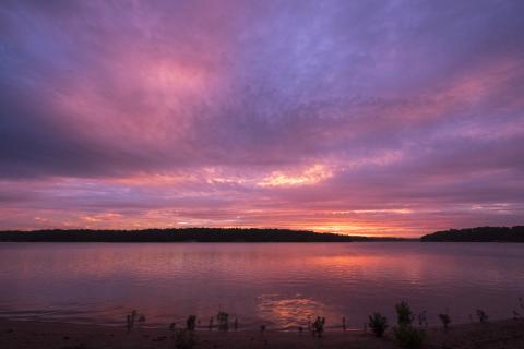 Sunshot by Bill Powell — An array of colors light up the sky at dawn on Saturday, June 26, over Lake Hartwell.
