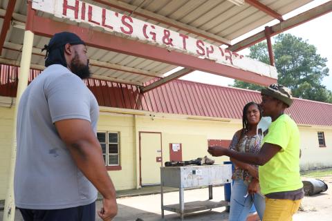 Sunshot by Grayson Williams — Pastor Frederick Vehe, left, Keesha Oglesby, center and Darlene Smith-Neal talk about their plans outside of the vacant G&T Snack Bar recently. 