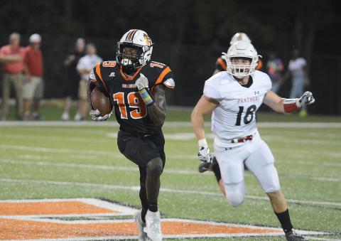Malachi Thomas runs away from a Jackson County defender in October, 2019. Thomas committed recently to attend Virginia Tech. Sunshot from file