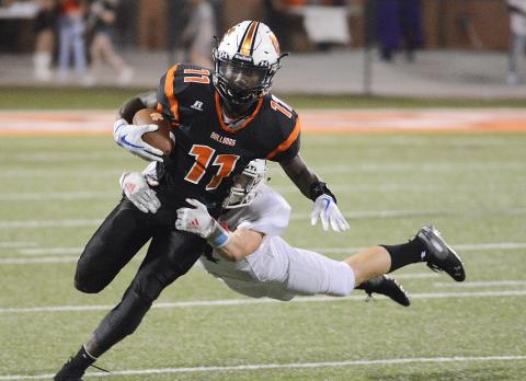 Sunshot from file — Paul Davis tries to shed a Jackson County tackler in 2019.