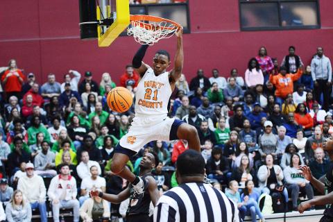 Sunshot from file — Hart County basketball player Shone Webb dunks during a Region 8-AAA tournament game in February. 