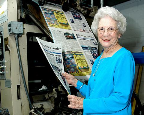Sunshot from file by Bill Powell — Wassie Vickery holds a newspaper fresh off the press at The Hartwell Sun in 2006. 