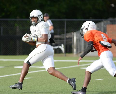 Sunshot by Grayson Williams - Receiver Malachi Kelley looks for running room up field after making a catch during the Bulldogs’ intrasquad scrimmage on Aug. 21 at Herndon Stadium. 