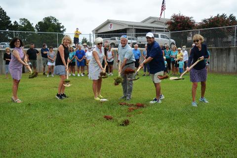 Sunshot by MIchael Hall - Above, Bell Family YMCA director Mandy Floyd, from left to right, and Lake Hartwell Pickleball Club members Angie Putman, Henley Cleary, president Eddie McCurley and Peggy Vickery break ground on what will become the club’s outdoor courts at the YMCA in Hartwell on Monday, Aug. 24.