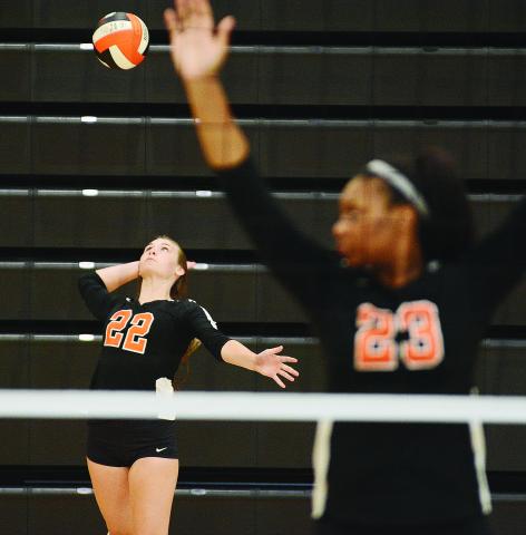 Sunshot by Michael Hall - Madison Wolfe serves during the Hart County Volleyball team’s win over Rabun County on Aug. 20 as LaMaya Sessoms prepares for action. 