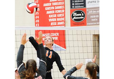 Sunshot by Michael Hall — Alex Burdette spikes the ball against Madison County at the Madison County Round Robin Tournament at Madison County High School on Saturday, Aug. 15. 