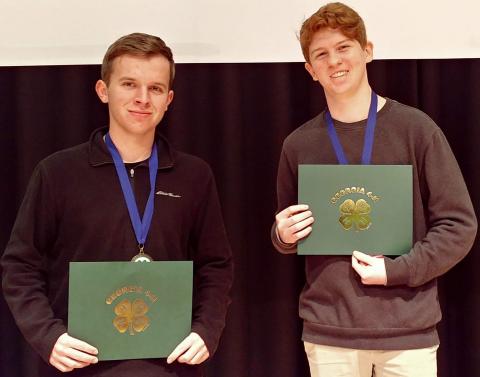 Photos submitted James Turpin, left, and Sean Leard, above, show off their certificates for participating in a recent virtual state competition.