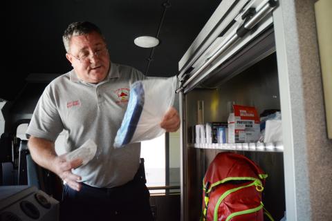 Sunshot by Michael Hall - Hartwell acting fire chief Alan Daniel goes through some personal protection equipment on the city’s new fire truck that the department uses during the COVID-19 pandemic. 