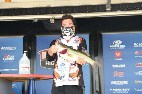 Photo submitted - Dawson Carden shows off the second-biggest fish of the tournament, a 5-lbs., 6-oz., largemouth at weigh in of the Mossy Oak Fishing Bassmaster High School Series.