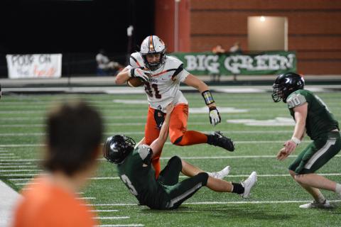 Sunshot by Grayson Williams Hart County’s Cane Berrong knocks over a North Hall defender on his way to a big gain on Sept. 18 in Gainesville. 