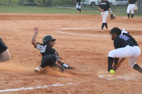 Sunshot by Grayson Williams Zoe Brock slides into third base safely on Tuesday at Hart County High School in the Lady Diamond Dogs’ senior night win over Monroe Area. 