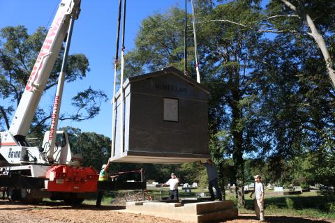 Sunshot by Grayson Williams - A 30-ton mausoleum is lowered with a crane onto its foundation at Northview Cemetery on Oct. 2.