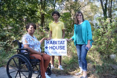 Sunshot by Grayson Williams - Yolanda Feaster, left, and her son, C.J., pose for a photo with Darlene Nixon, Hart Habitat for Humanity executive director Darlene Nixon, right, at the site of what will be the Feasters’ new home. 