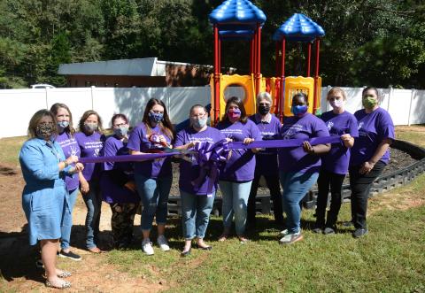 Sunshot by Michael Hall - Pictured from left to right are Teresa Neese (board president), Taylor Burnett, Tina Sosebee, Tiffany Holland, Kristen Jackson, Barbara Stowe, Isabel Bocanegra, Katherine Reusing (executive director), Tekara Rucker, Mallory Rowland and Joanna Fleming.