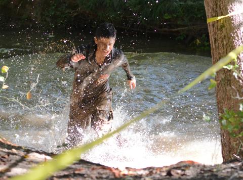 Luis Genchi crosses a water obstacle. 