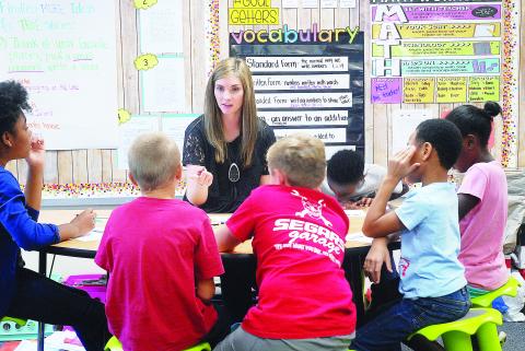 Sunshot from file - Andrea Gibbs works with students in her class in 2018 at Hartwell Elementary. 