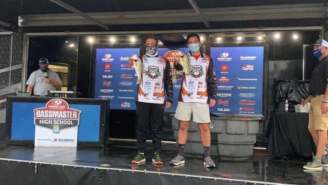 Dawson Carden, right, and Griffin Milford, left, show off fish they caught at the national championship on Kentucky Lake last week. 