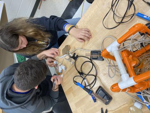 Students in last year’s engineering and technology class at Hart College and Career Academy taught by Marvin McDuffie work on underwater robots. 