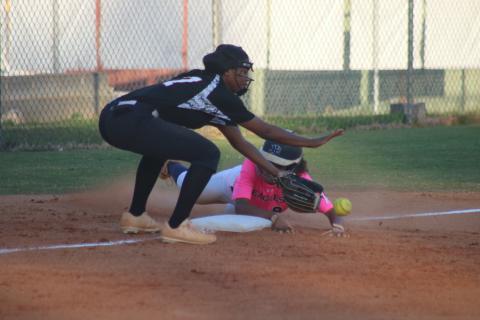 Sunshot by Grayson Williams -  Jazania Shealer attempts to make a play at third base in the Lady Diamond Dogs’ win over East Jackson on Tuesday, Oct. 6.