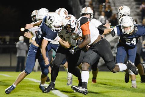 Sunshots by Michael Hall Hart County’s Malachi Thomas bulldozes his way through an East Jackson defender in Commerce on Nov. 13 in the Bulldogs’ region victory over the Eagles. 