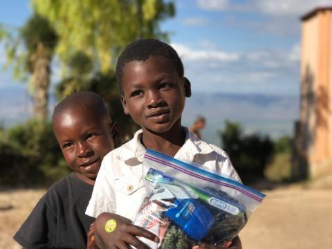 Photo submitted - Children in Haiti smile with their Joybags given to them by Love Him Love Them ministries during a trip to Haiti last holiday season. 