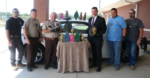 Pictured from left to right are, Inv. Chris Carroll, deputy Josh Fowler, Sheriff Mike Cleveland, District Attorney Parks White, Inv. Kevin White and Inv. Joseph Haley with 47 pounds of methamphetamine disguised as candles that were seized in September 2019.