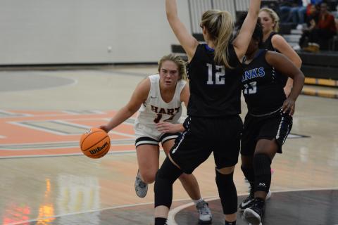 Sunshot by Grayson Williams Hart County’s Dakota Phillips dribbles around Banks County defenders in a scrimmage at Hart County High School on Nov. 17.