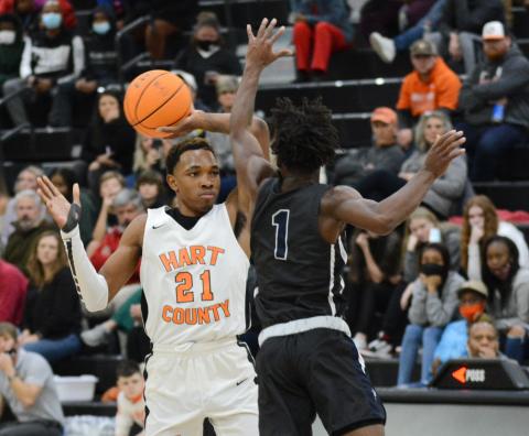Sunshot by Michael Hall — Hart County’s Shone Webb pulls the ball back from an Elbert County defender at Hart County High School on Dec. 16 in the Bulldogs’ first win of the week over the rival Blue Devils.