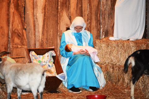 Sunshot by Michael Hall — Mary looks at baby Jesus during the Living Nativity at Cornerstone Baptist Church on Dec. 10.