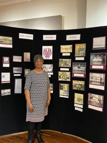 Loretta King poses for a photo in February with the African-American history exhibit she put together at The Art Center. 