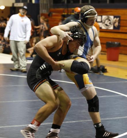 Photo by Rose Scoggins - Logan Lopez tries to take down his opponent Tuesday, Dec. 1 in Elbert County. 