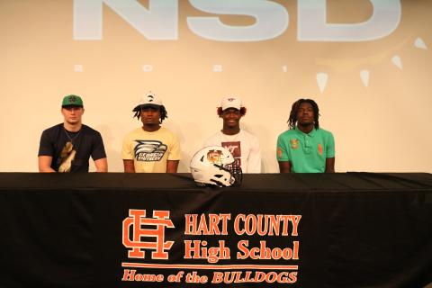 Sunshot by Grayson Williams — Cane Berrong, from left to right, Montae Maxwell, Malachi Thomas and Xavier Brown, after signing letters of intent to play football in college. 