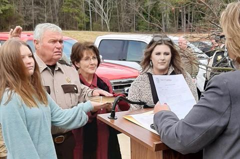 Pictured are, second from left, Cleveland, alongside, left, granddaughter Natalie Jo Morris, second from right, wife Coni Jo Cleveland, and, right, daughter Madison Morris.