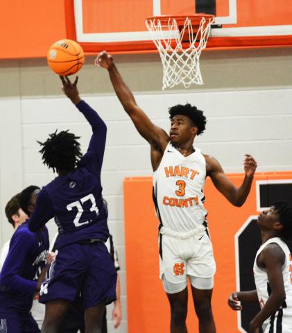 Sunshot by Michael Hall Hart County’s Tahj Johnson blocks a shot by a Monroe Area player at Hart County High School on Friday, Jan. 8, in the Bulldogs’ first region win of the season. 