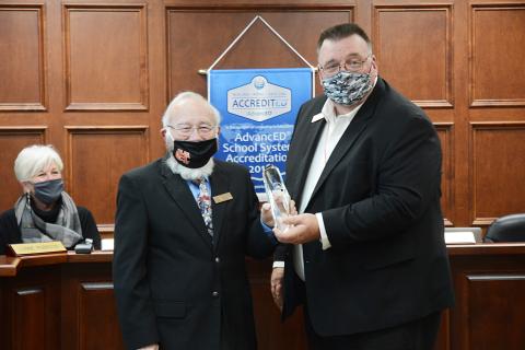 Sunshot by Michael Hall - Hart County Charter System superintendent, Jay Floyd, right, presents the Exemplary School Board award to board chairman Richard Sutherland.