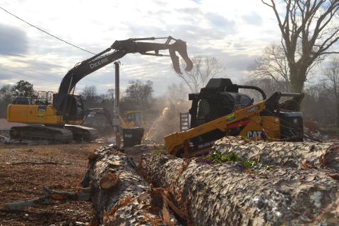 Sunshot by Drew Dotson - Workers use heavy equipment to clear the land at 55 Ridge Road to make way for two buildings that will house two new businesses. 