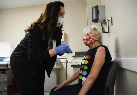 Sunshot by Michael Hall - MedLink nurse Trish Jones prepares to give a COVID-19 vaccine to Hartwell resident Lou Ann Farrar at MedLink in Hartwell on Friday, Jan. 15. The community health clinic vaccinated 100 people in a special vaccination event Friday. 