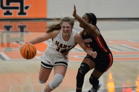 Sunshot by Grayson Williams - Dakota Phillips drives past a Stephens County defender on Tuesday, Jan. 19, at Hart County High School. 
