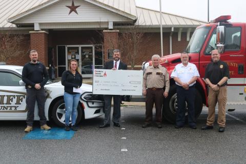 Sunshot by Grayson Williams Pictured from left to right during an arson reward ceremony are Hart County Inv. Chris Carroll, reward recipient Samantha Lack, Georgia Arson Control representative Kenneth Lecroy, Hart County Sheriff Mike Cleveland, Hart County Fire Chief Jerry Byrum and Georgia State Fire Marshal’s Office representative Brian Smith.