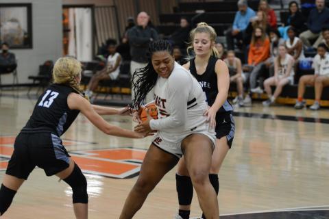 Sunshot by Grayson Williams - Taniya “Nesha” Alexander fights with Oconee County defenders for the ball on Monday at Hart County High.