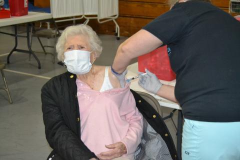 Sunshot by Drew Dotson - Hart County resident Doris Mahannah, who is 104 years old, gets her second dose of the COVID-19 vaccine on Tuesday, at Flat Shoals Baptist Church in Bowersville.