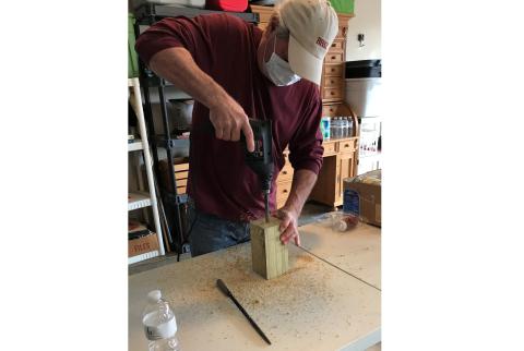 Don Meyer, above, makes a carpenter bee trap for Golden K recently. 