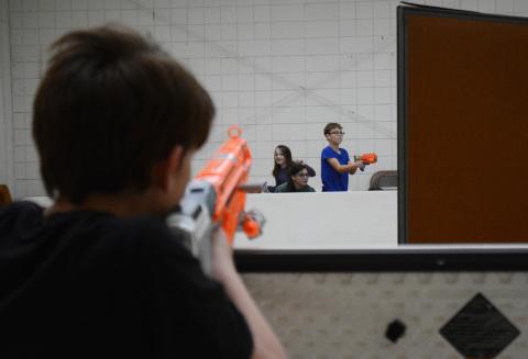 Sunshots by Michael Hall - Xavier Johnson, left, takes aim at Emilee Shaw, second from left, Lilly Palmer, second from right, and Blake Allgood, right, during a Nerf gun battle on Tuesday, Feb. 16, at HYDRA during the program’s winter break camp. 