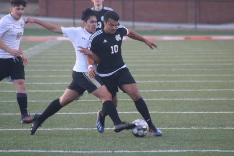 Sunshot by Grayson Williams Renso Escobedo battles for possession with a Commerce player at Hart County High School on Monday, Feb. 8.