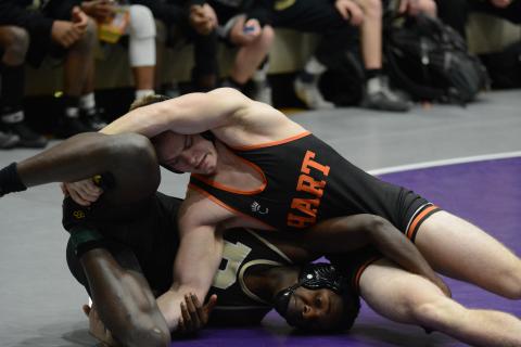 Hart County’s Nate Bennett rolls with a Rockmart opponent on Saturday, Jan. 30 at Cherokee Bluff High School in Flowery Branch. The Mat Dogs finished sixth in the state in the Class AAA duals wrestling tournament. 