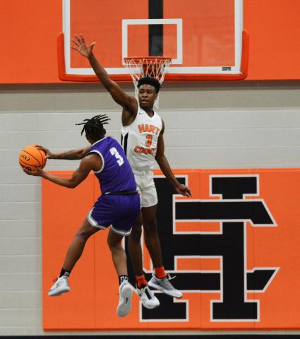 Tahj Johnson prohibits an open shot by a Cherokee Bluff player on Feb. 27, at Hart County High School. 
