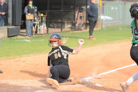  “Boo” Mitchell slides into home plate in the softball team’s victory over rival Franklin County.