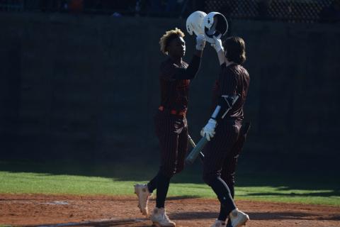 Photo by Shane Scoggins/Franklin County Citizen Leader Hart County players Malachi Thomas, left, and Casey Tallent, right, bump helmets in celebration during a double-header on Friday, April 2 at Franklin County.