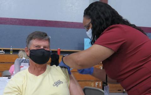 Photo submitted - Local resident Joby Scroggs receives his second Moderna vaccine from nurse Theresa Curry.