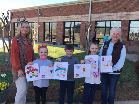 Submitted photo Pictured: left to right in the Coloring Contest: Angela Wood, HCFB Office Manager, 1st place – Bailey Driscoll, 2nd - Grayson Morris, 3rd – Millie Colson and Patti York, HCFB Women’s Committee Chair.